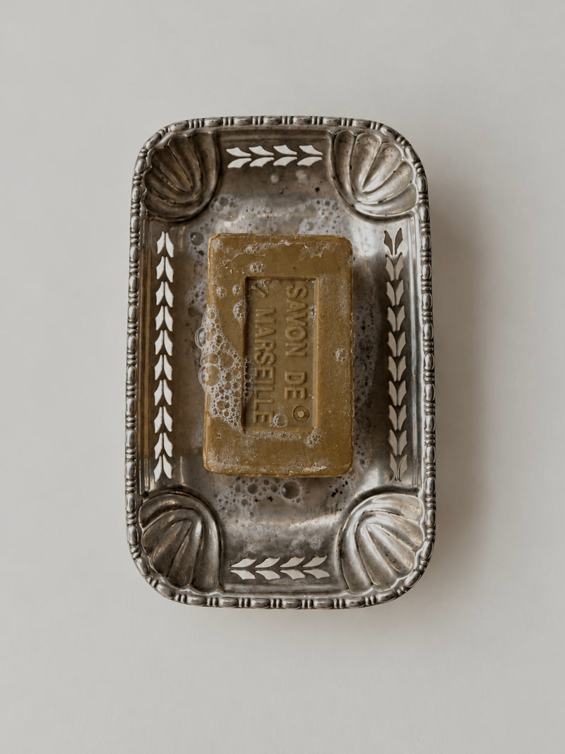 Top view of vintage silver plated soap dish with Marseille soap