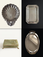 Editorial moodboard of vintage silver serving pieces and green onyx jewelry box