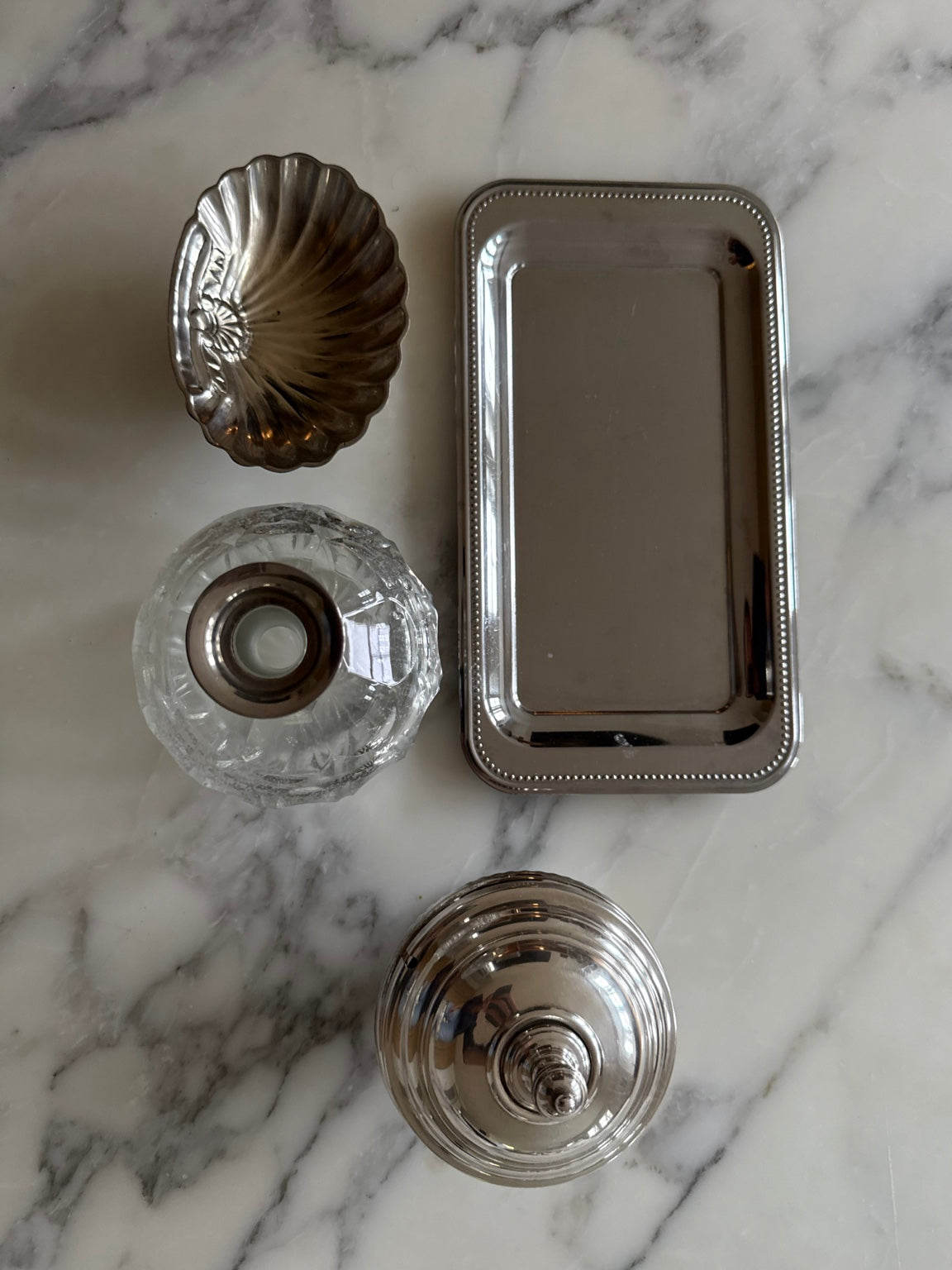 Guy Degrenne tray styled alongside vintage decorative objects