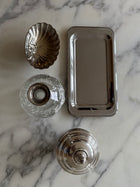 Guy Degrenne tray styled alongside vintage decorative objects