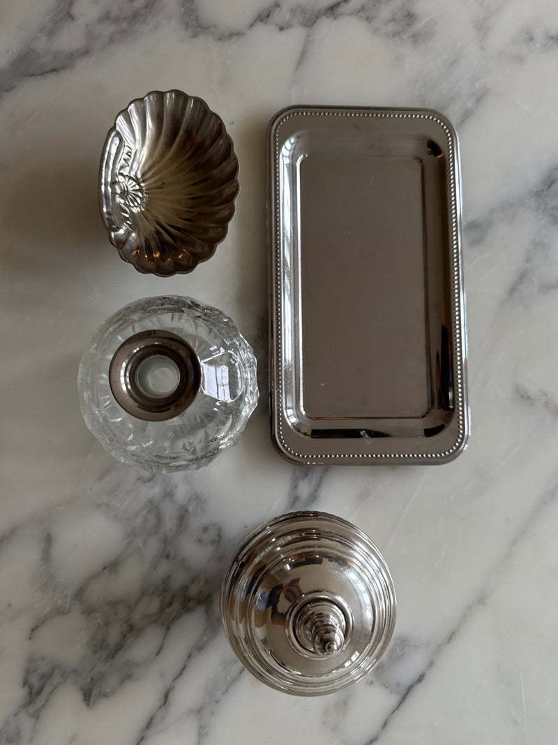 Guy Degrenne tray styled alongside vintage decorative objects