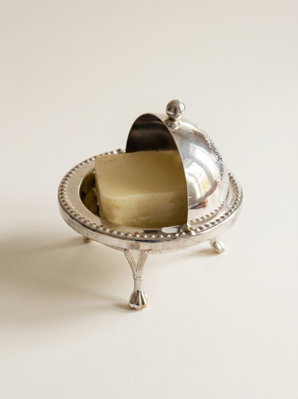 Vintage English silver tone butter dish with rotating domed lid
