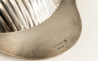 Close-up of Fleuron France maker's mark on vintage silver-plated scallop dish