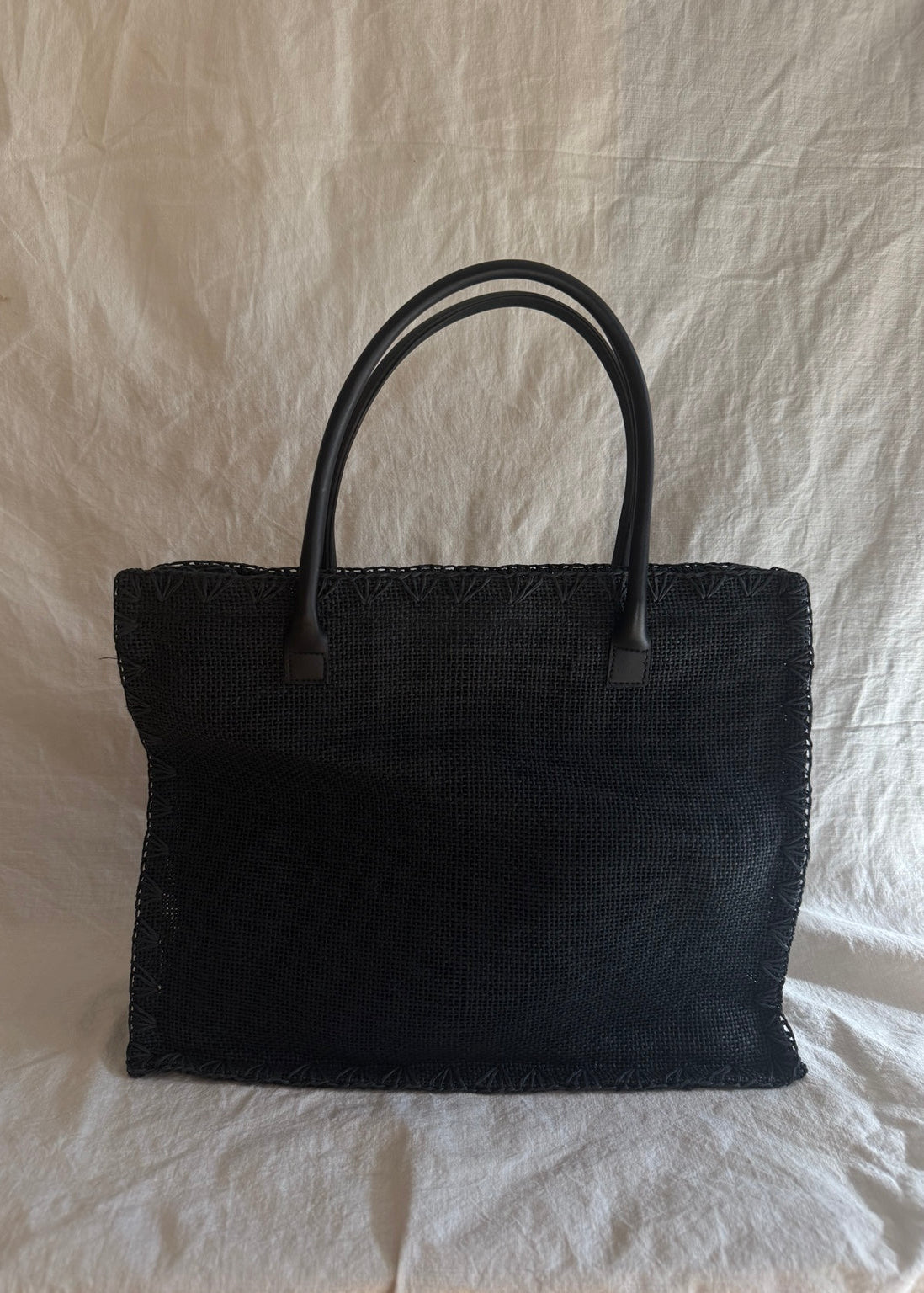 Laura Ashley vintage black woven tote with structured rectangular silhouette and faux-leather handles