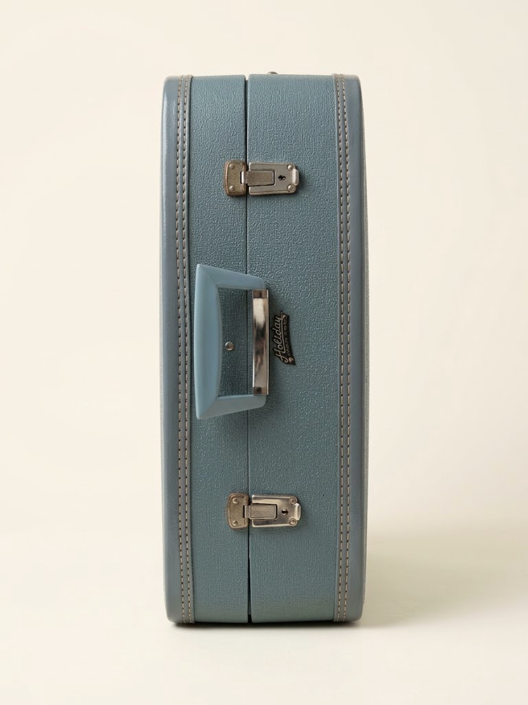 Vintage blue luggage for kids room decor and storage