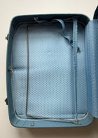 Vintage blue luggage interior with patterned lining