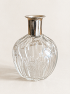 Vintage glass bottle with silver-tone collar