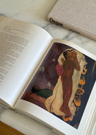 Vintage Gauguin art book open to Spirit of the Dead Watching