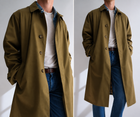 Vintage military green oversized raincoat shown on a man