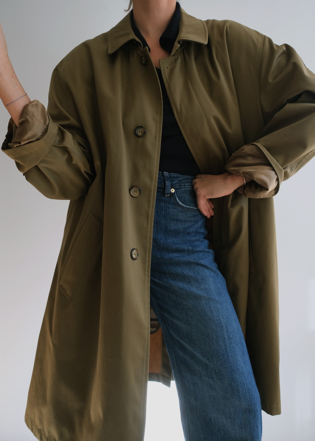 Vintage military green long raincoat shown in oversized women's fit