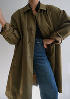 Vintage military green long raincoat shown in oversized women's fit
