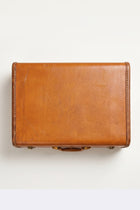 Authentic vintage Samsonite suitcase in warm caramel brown
