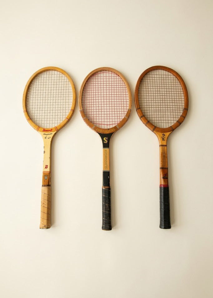 Set of three vintage wooden tennis rackets for decorative use
